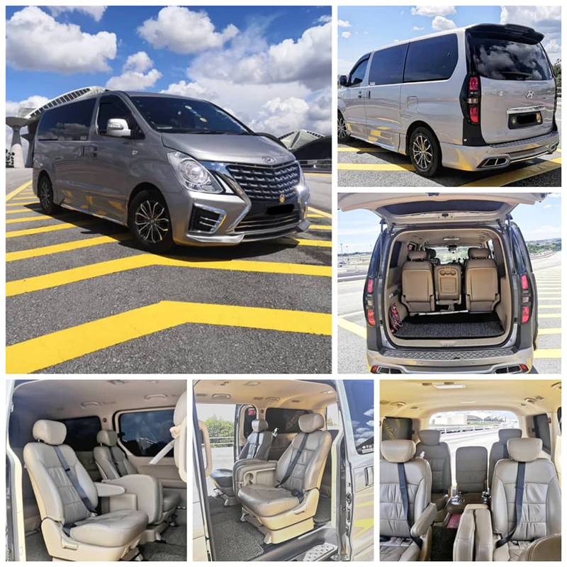 Grey premium minivan with its boot open and rows of leather seats inside